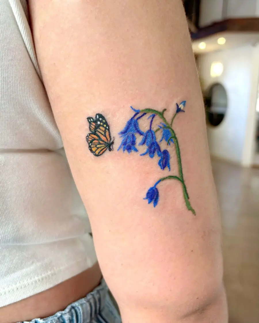 Elegant birth flower tattoo with a butterfly