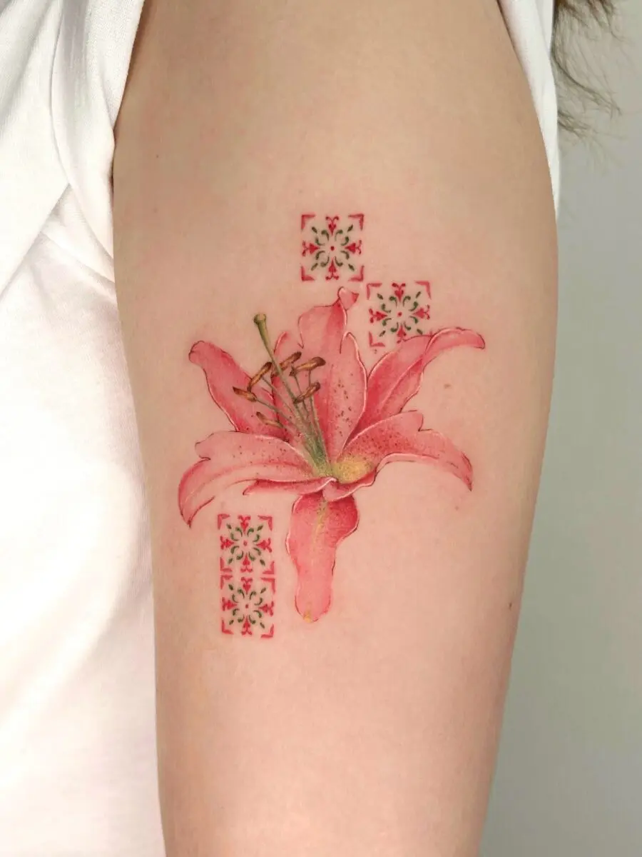 Elegant pink lily tattoo with decorative elements