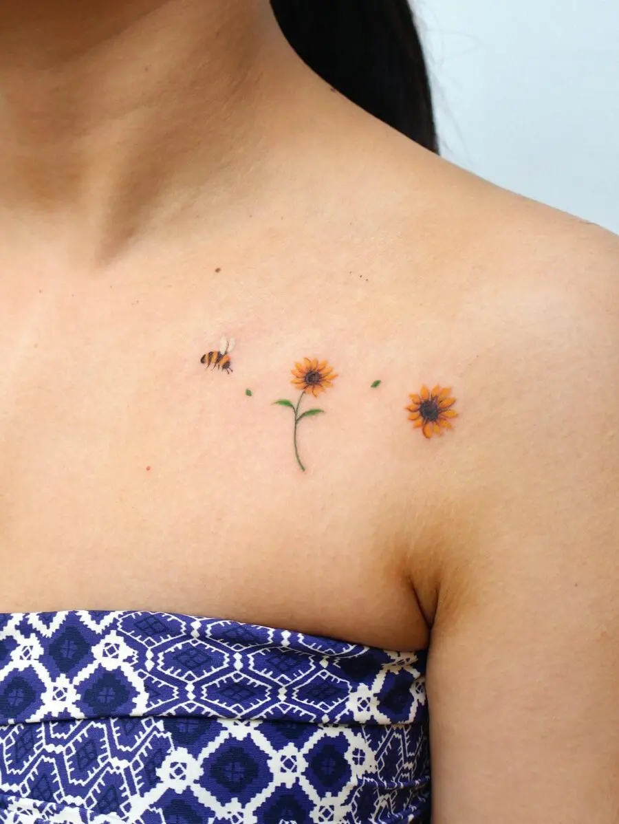 Charming floral and bee tattoo design