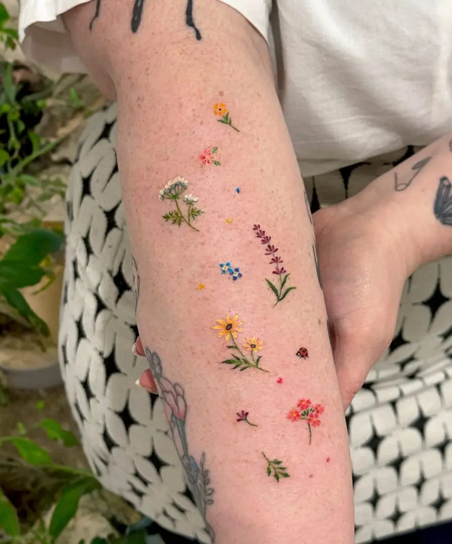 Colorful floral tattoos celebrating birth months