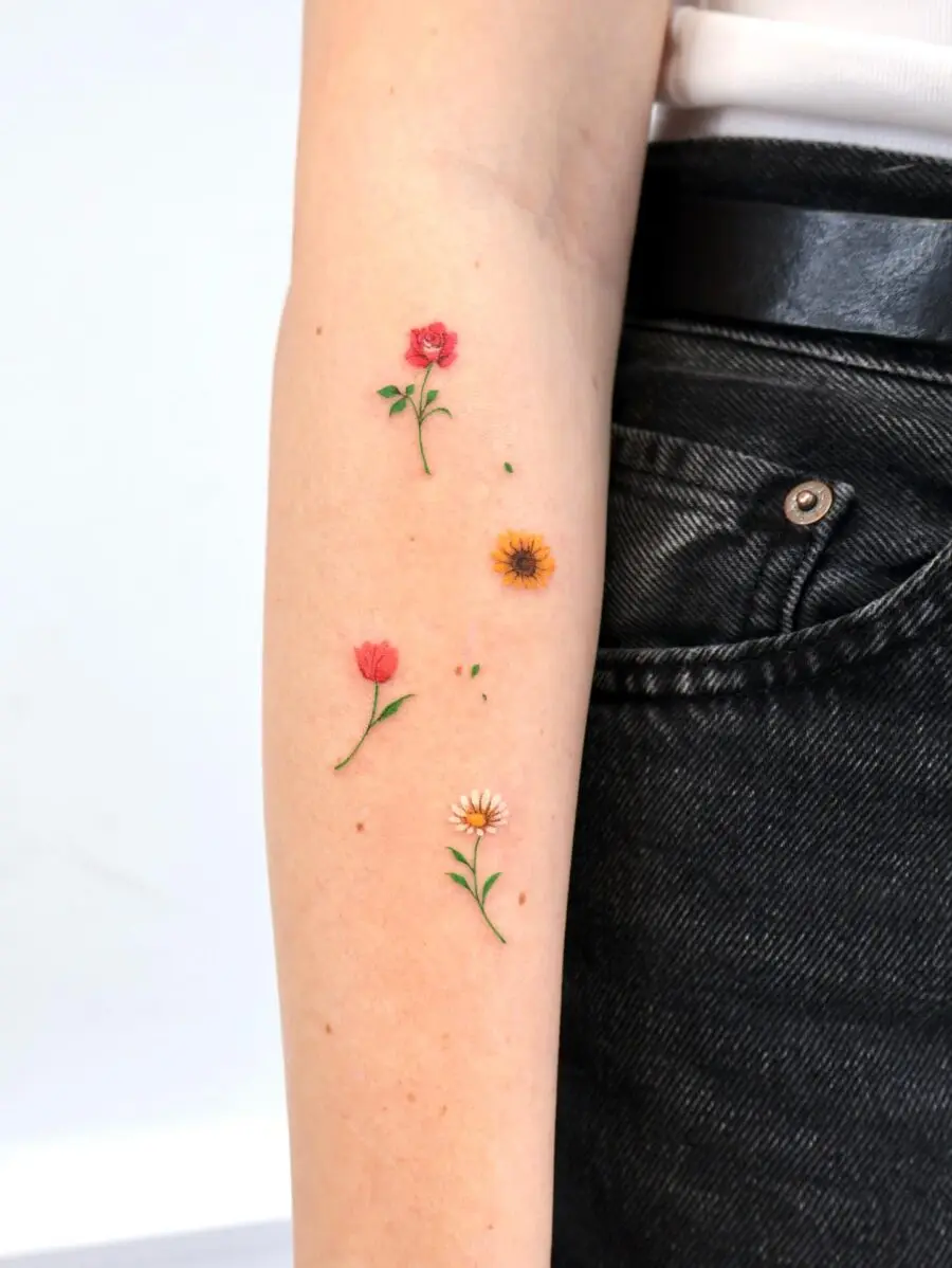 Charming birth flower tattoos in vibrant colors