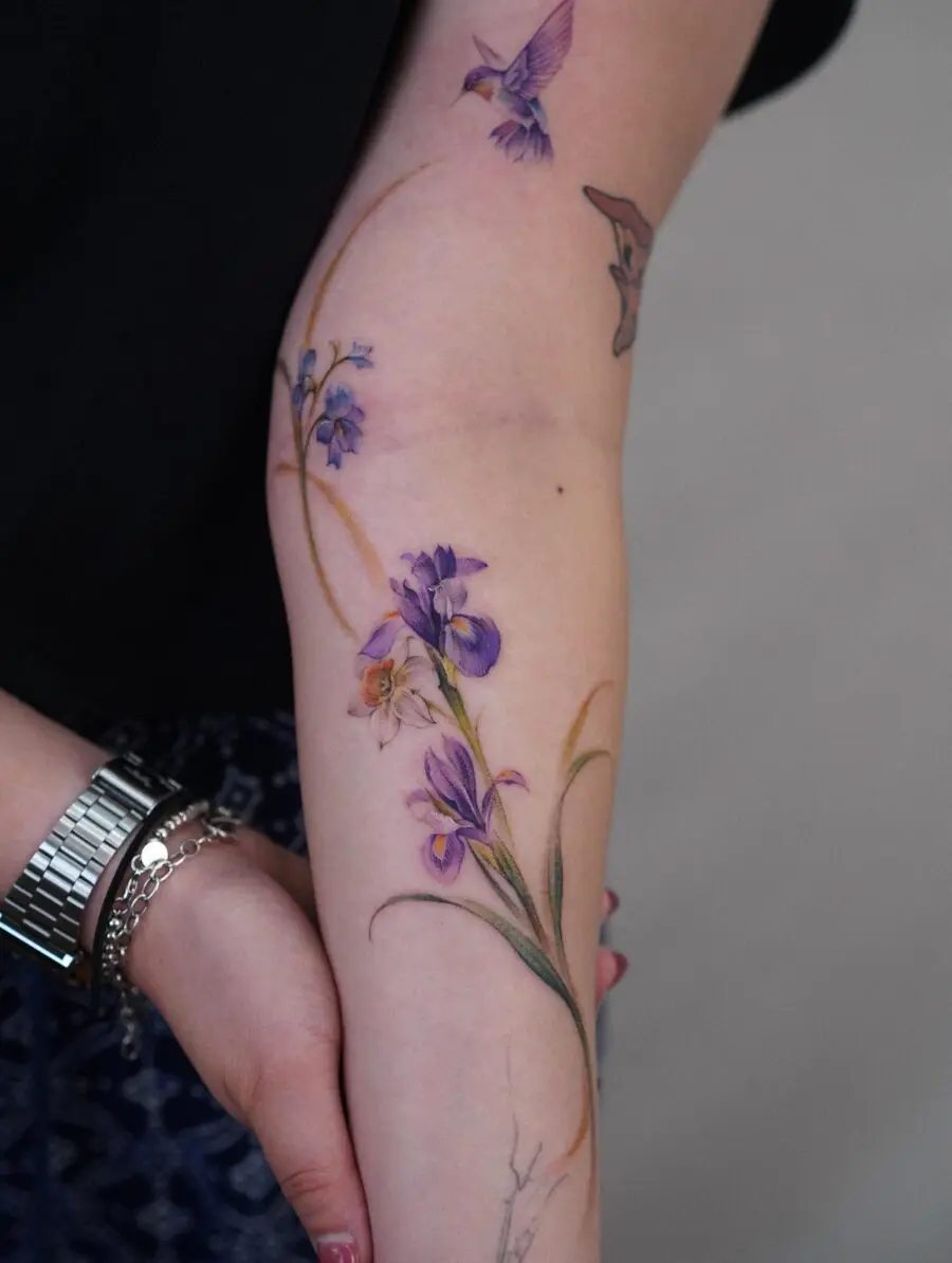 Elegant blooming iris with a hummingbird accent