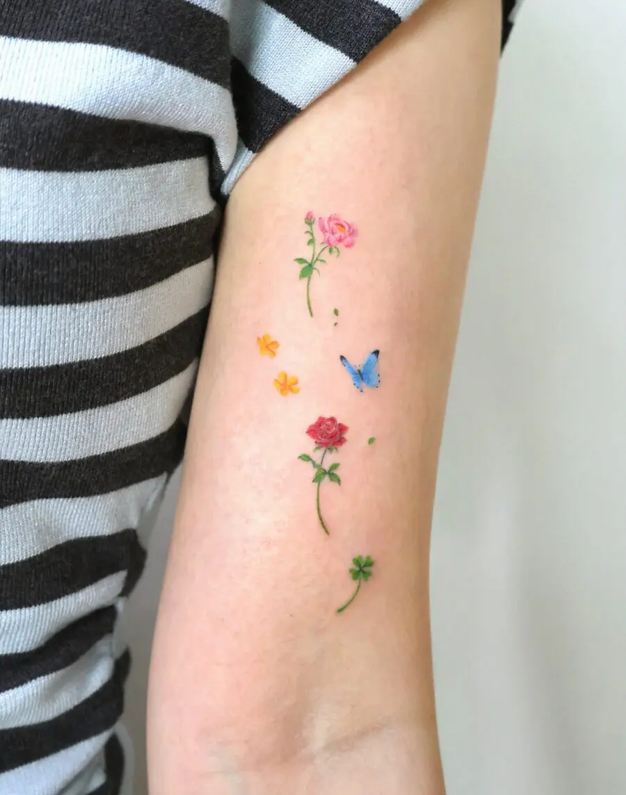 Elegant floral tattoo design with butterfly accent