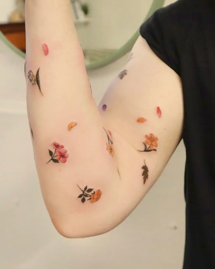 Colorful floral tattoos on the arm