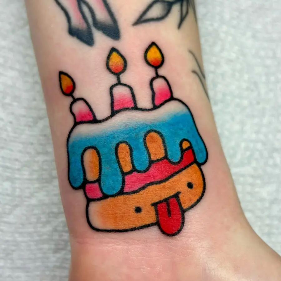 Playful Birthday Cake Tattoo with Candles