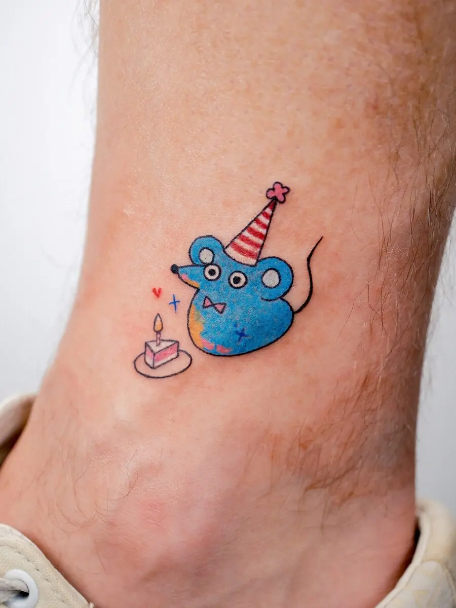 Playful mouse tattoo celebrating a birthday