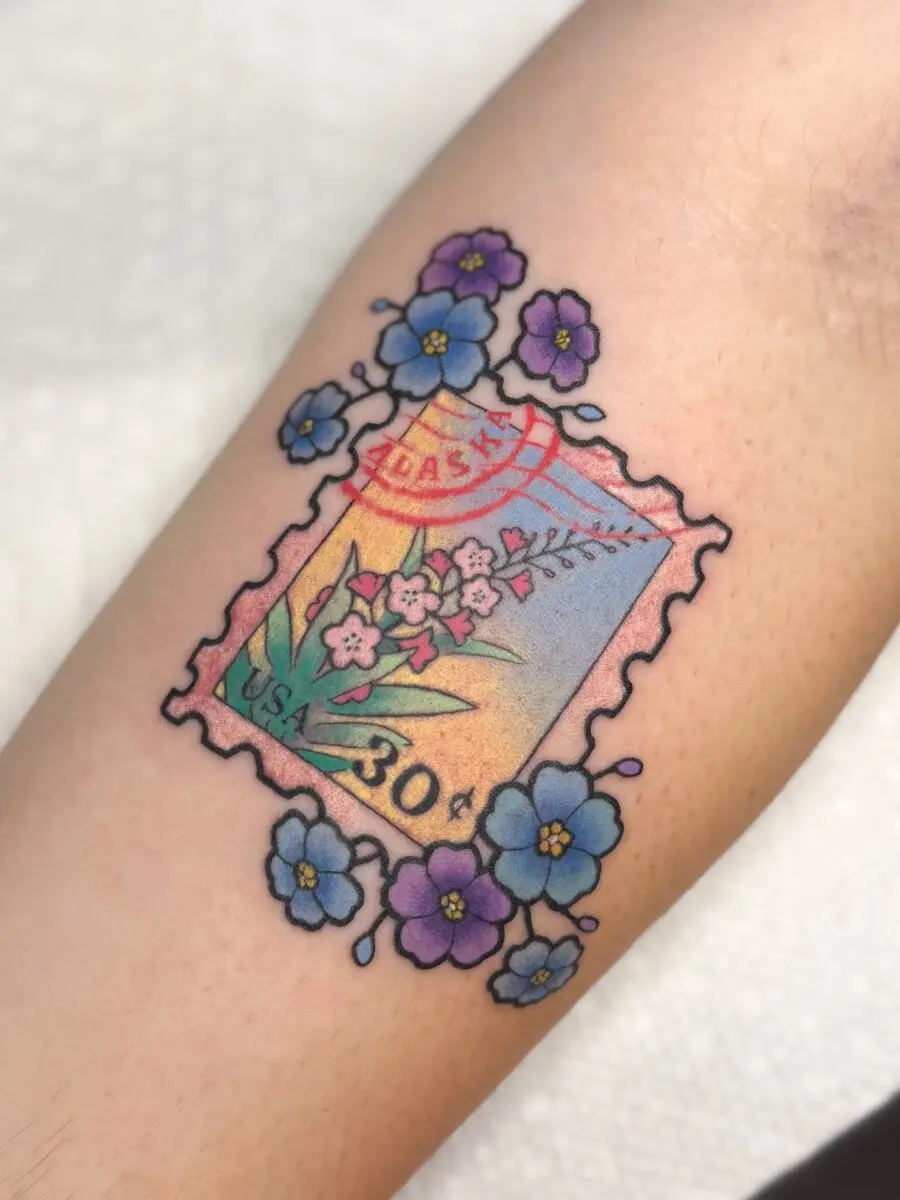 Colorful stamp-inspired design for birthday tattoos