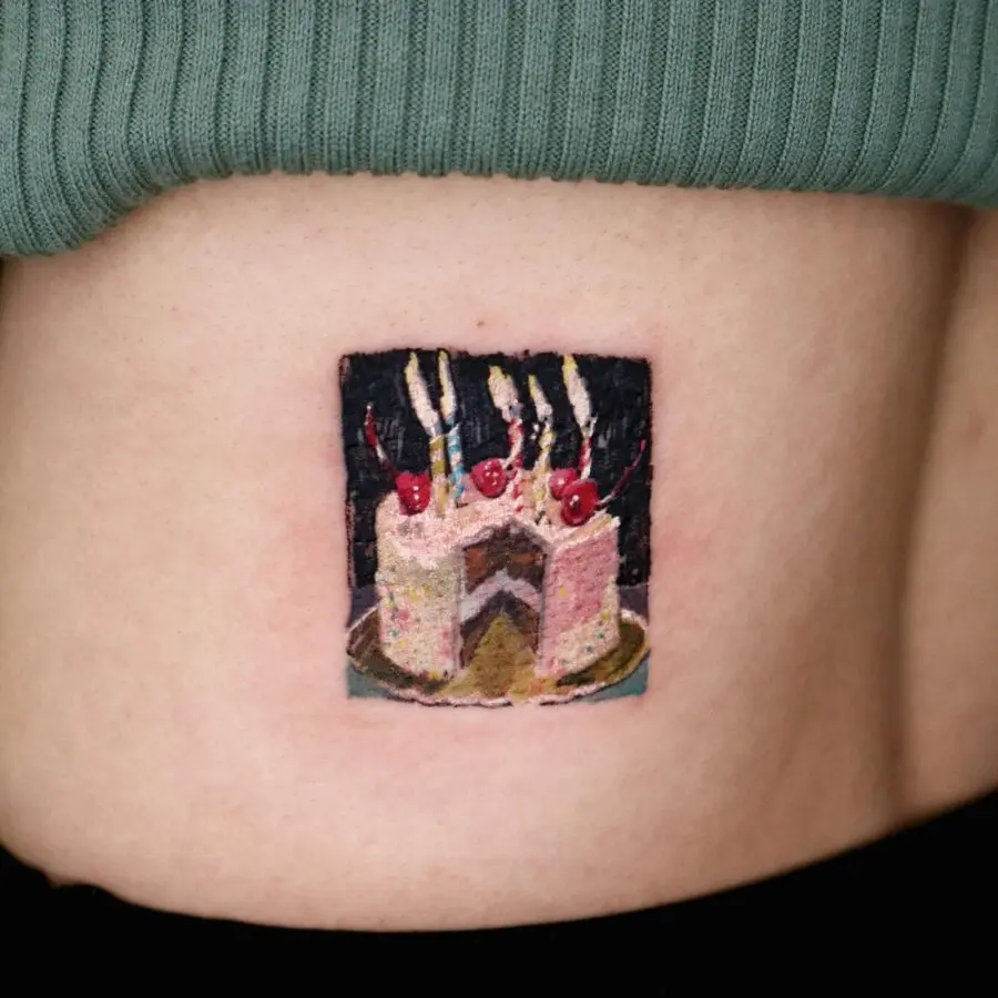 Vibrant Cake Tattoo Celebrating Special Moments