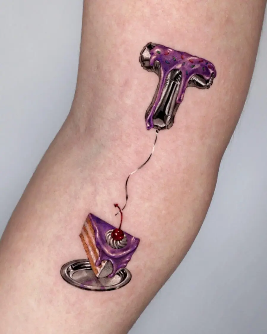 Whimsical tattoo featuring cake and frosting