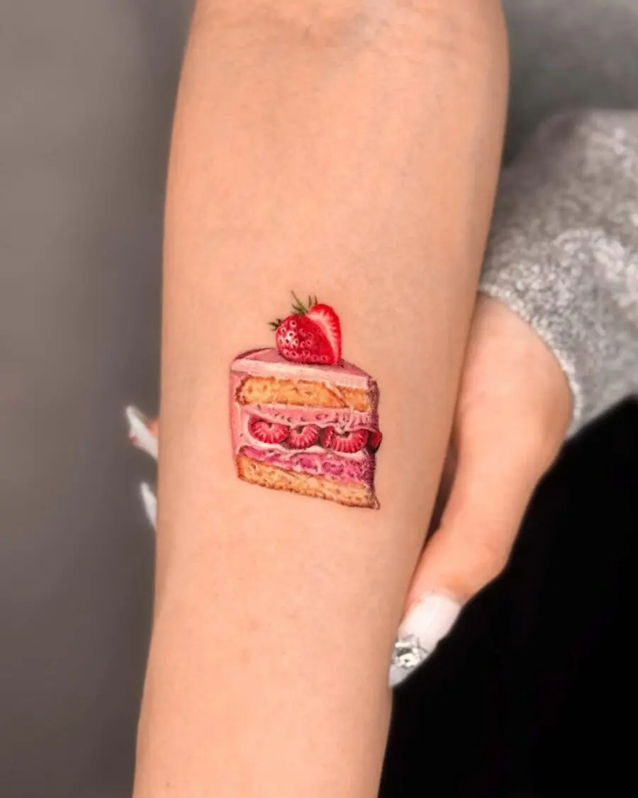 Whimsical cake tattoo with vibrant colors