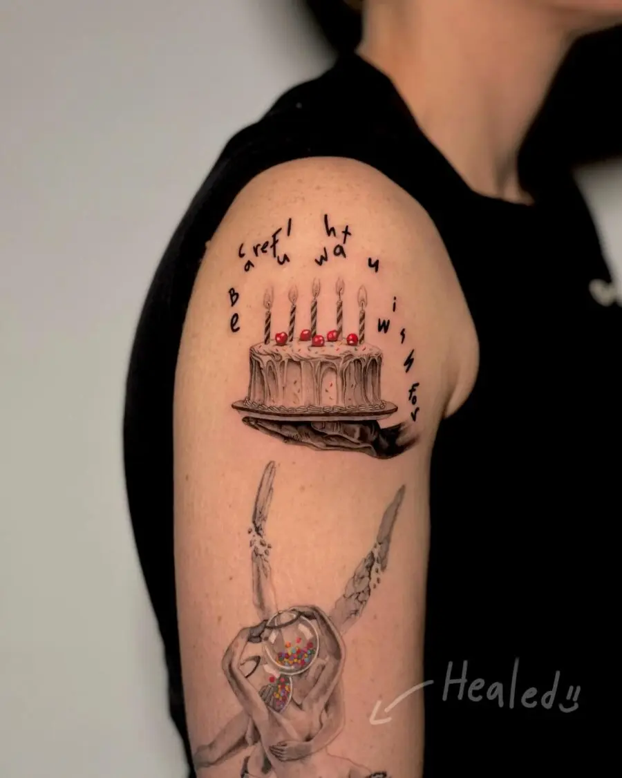 Creative birthday tattoo celebrating wishes and cake