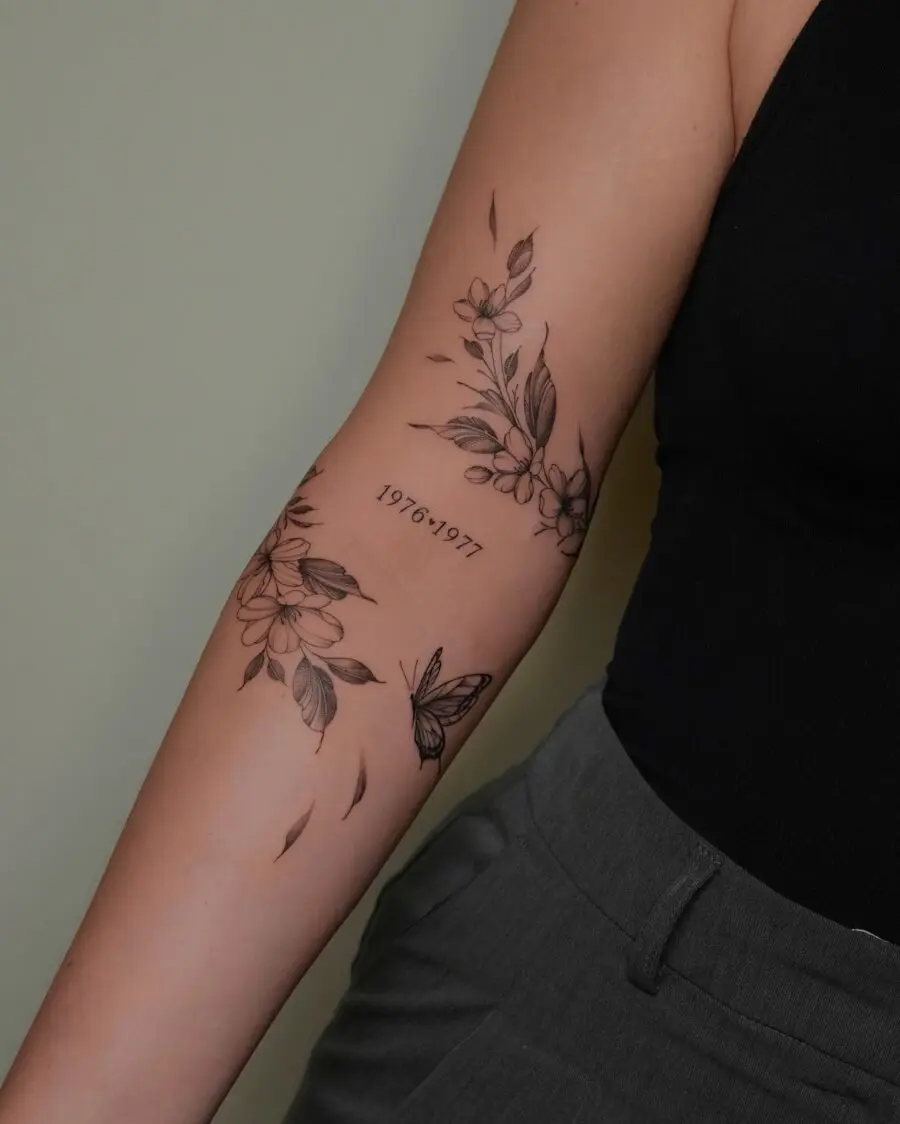 Floral-themed birthday tattoo with butterfly