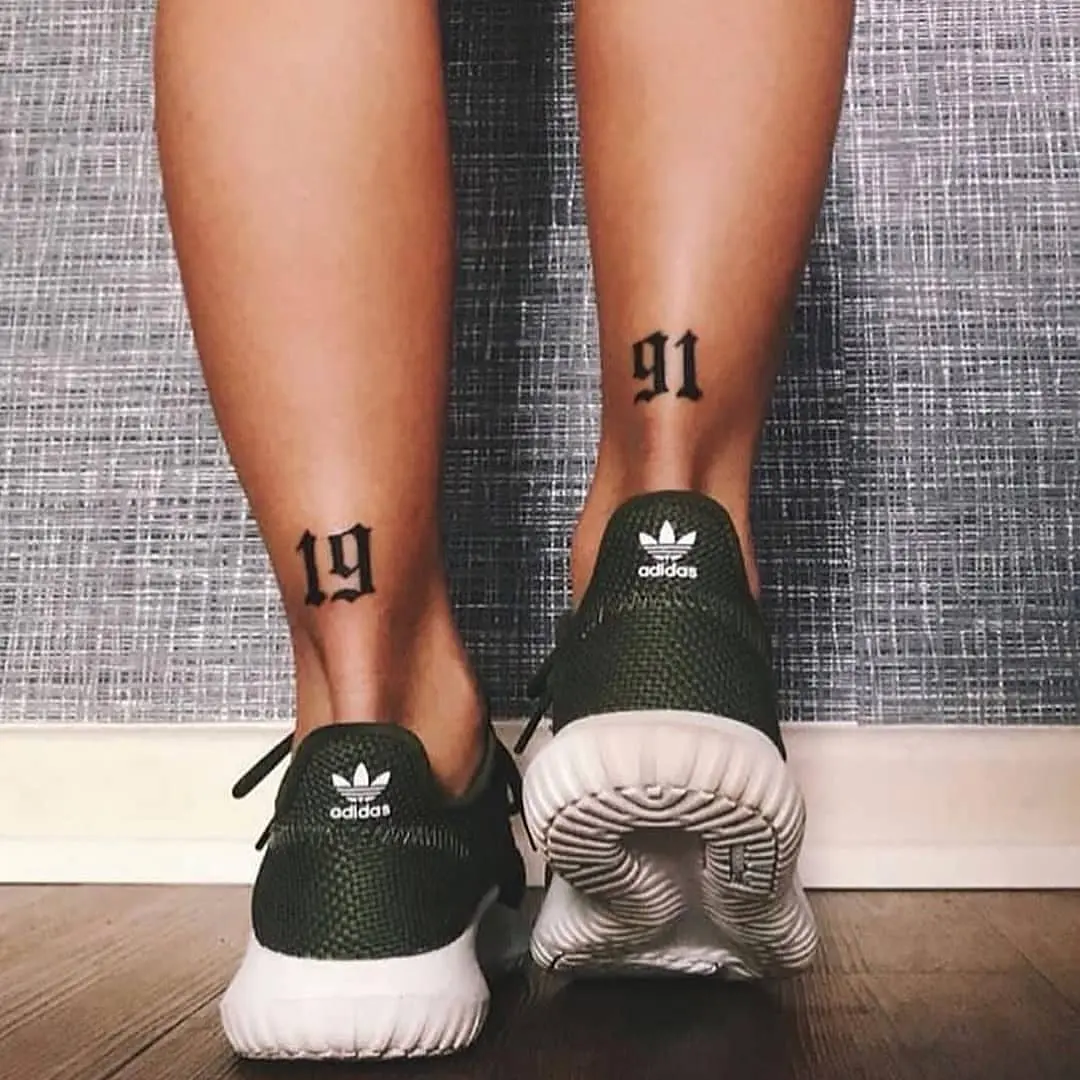 Stylish birthday tattoo showcasing meaningful numbers.