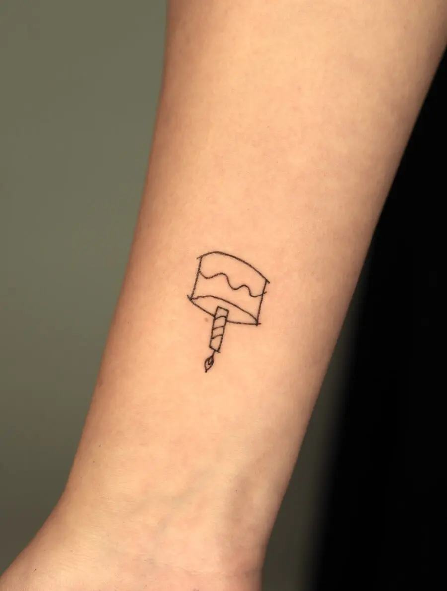 Delicate cake tattoo for joyful celebrations