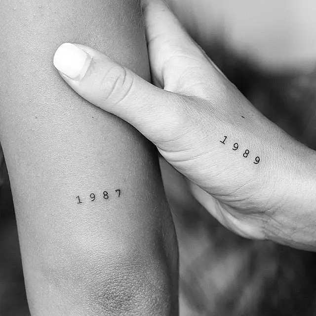 Elegant minimalistic birthday year tattoos