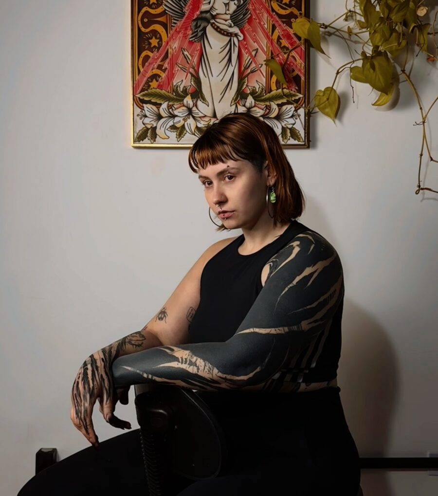 Striking black sleeve tattoo showcasing bold artistry