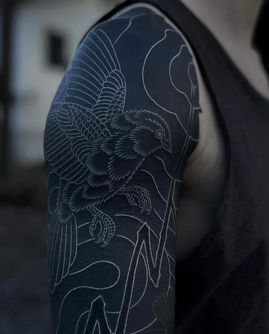 Stylish black sleeve tattoo featuring a bird