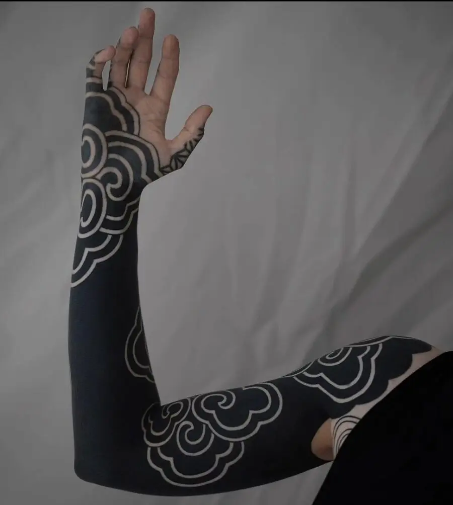 Elegant black cloud sleeve tattoo design