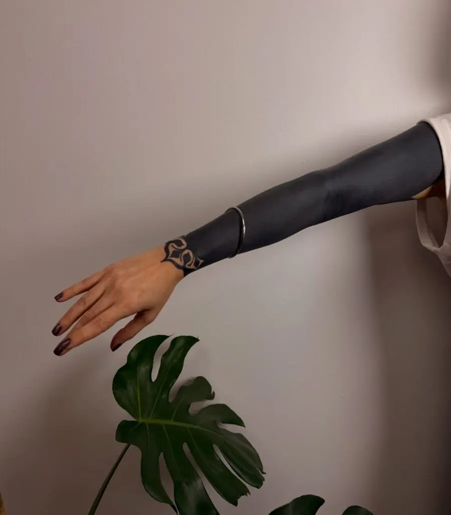 Stylish black sleeve tattoo showcasing intricate design