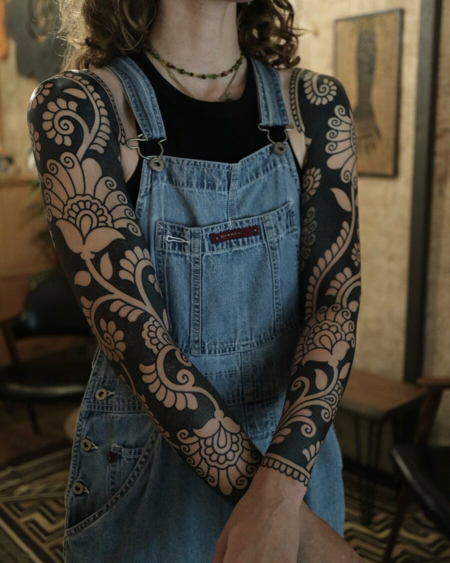 Intricate floral black sleeve tattoo design