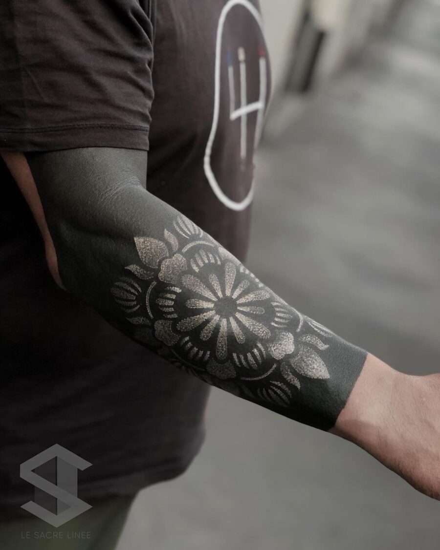 Elegant floral black sleeve tattoo design