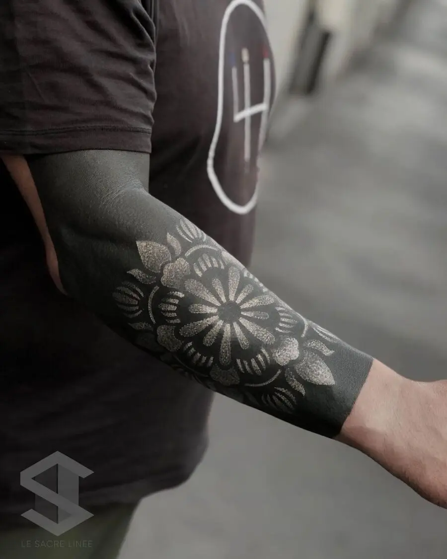 Elegant floral black sleeve tattoo design