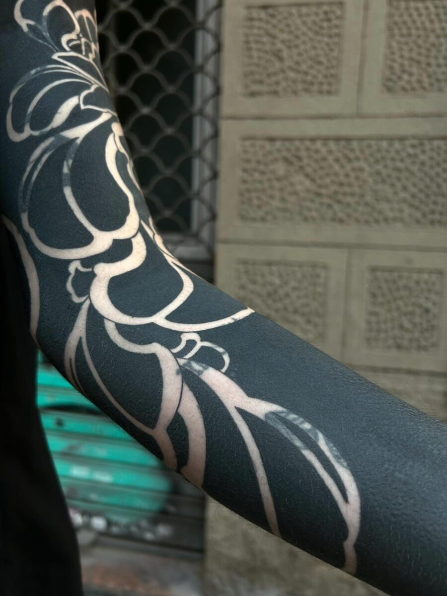 Elegant floral black sleeve tattoo design