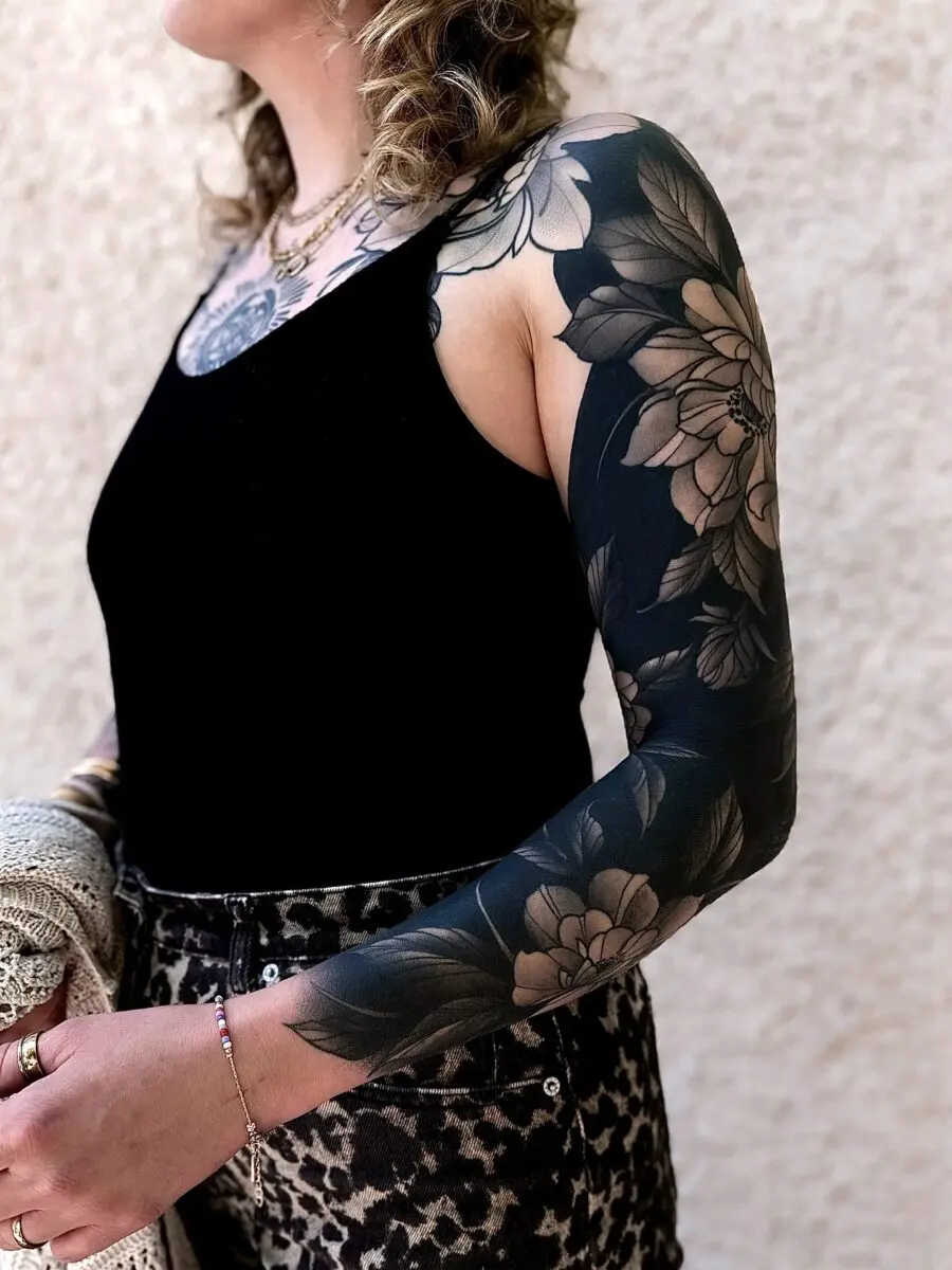 Elegant Floral Black Sleeve Tattoo Design