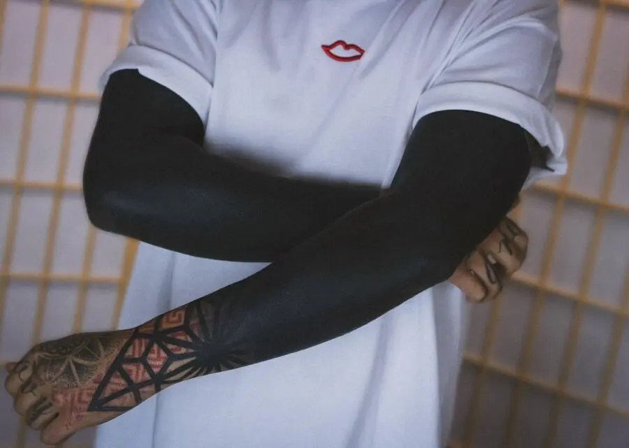 Stylish black sleeve tattoo for minimalist vibes