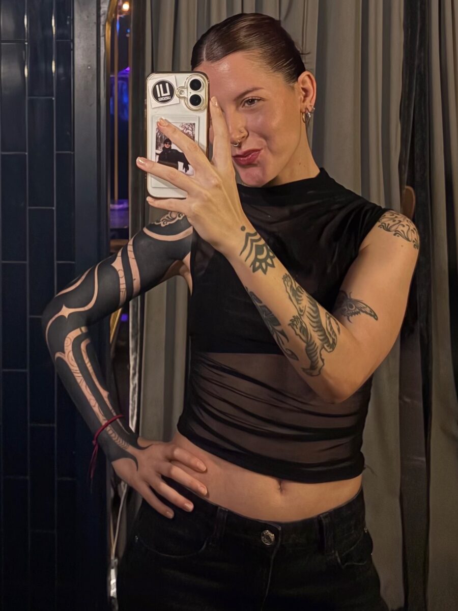 Bold black sleeve tattoo showcasing unique designs