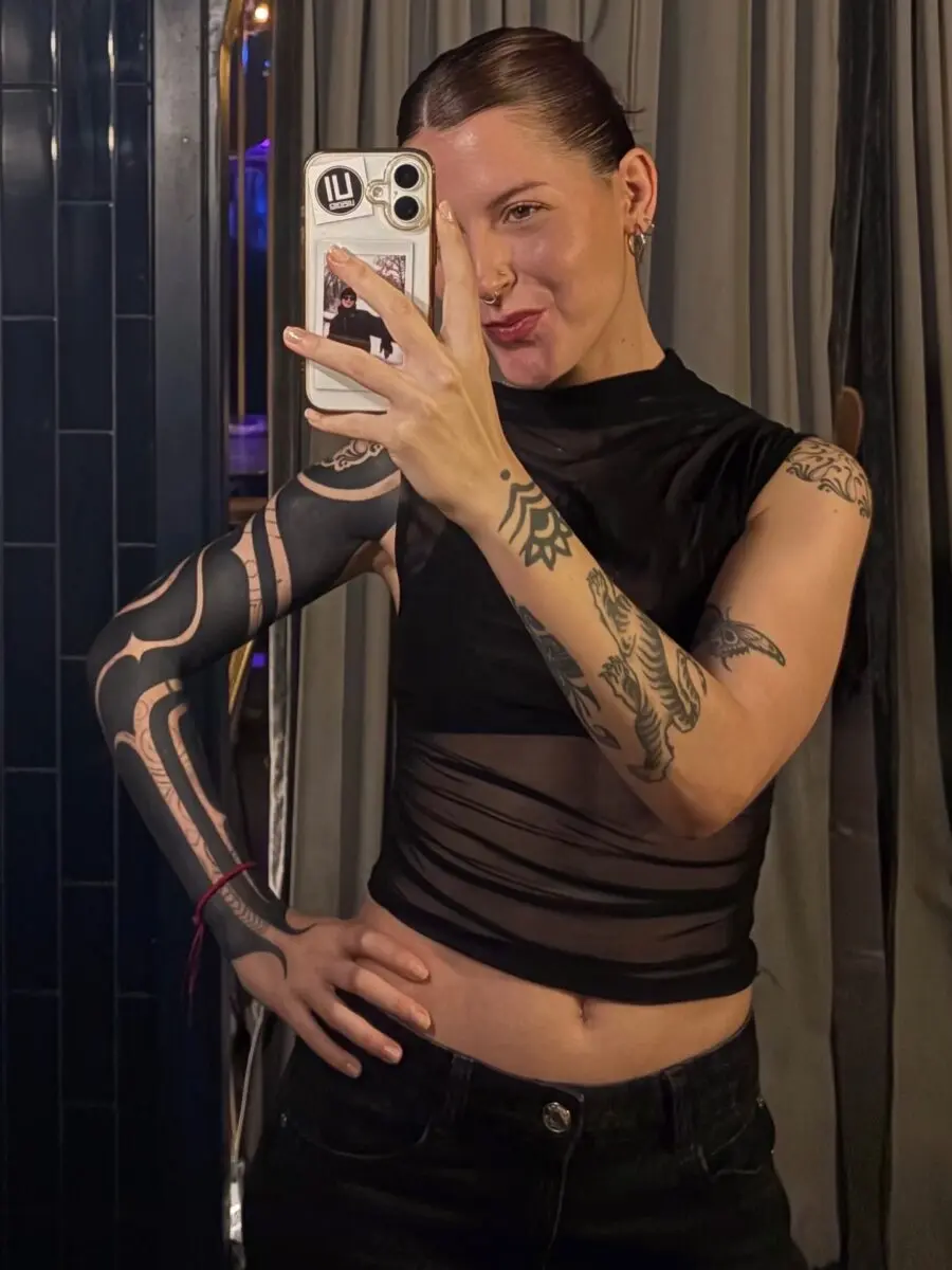 Bold black sleeve tattoo showcasing unique designs
