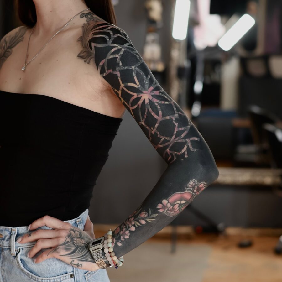 Elegant floral black sleeve tattoo design