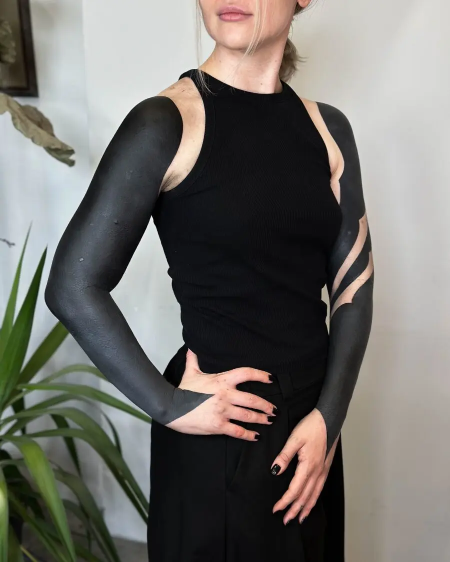 Striking black sleeve tattoo with modern flair