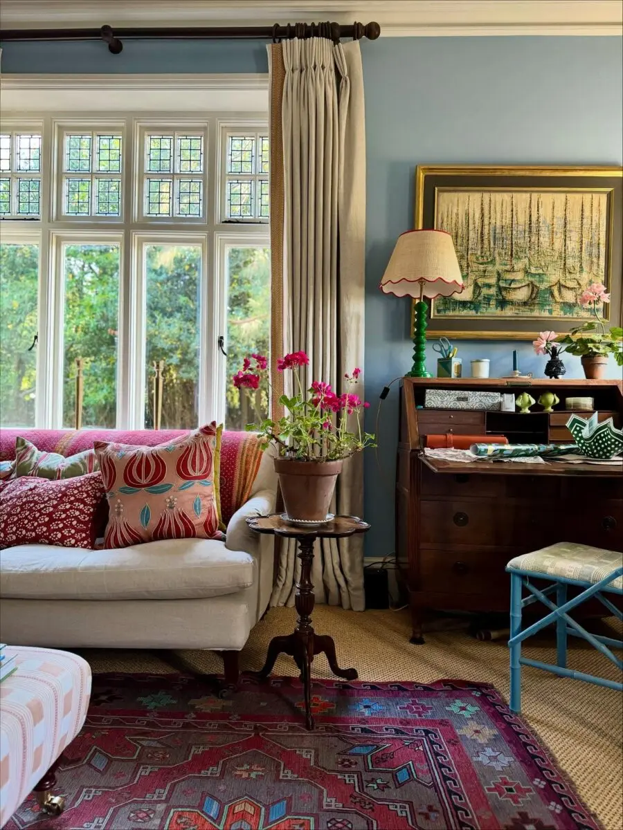 Charming blue living room with colorful accents