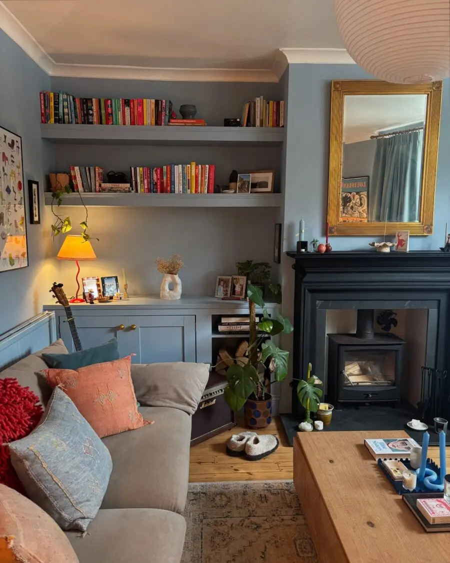 Charming blue living room with stylish shelves