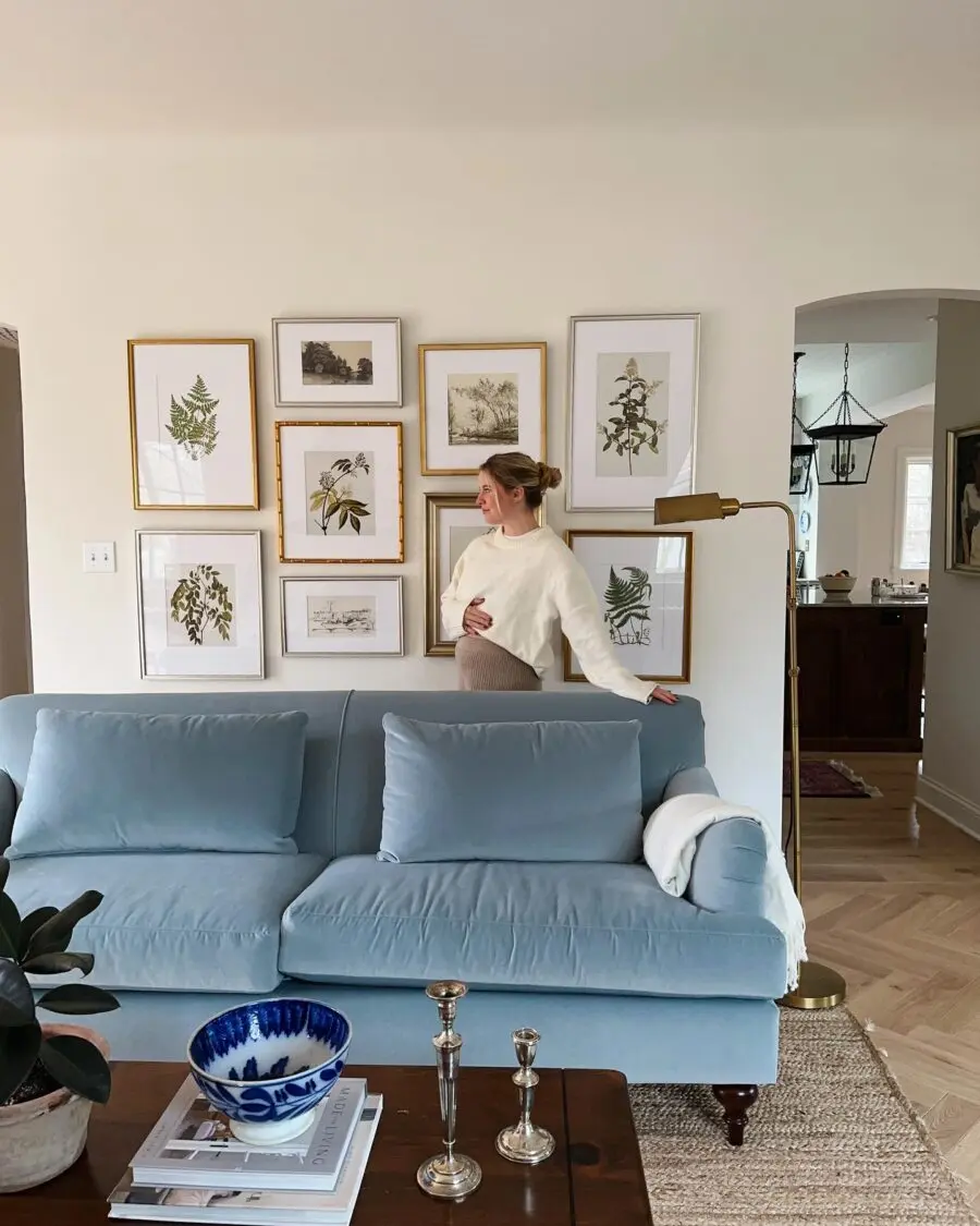 Elegant blue living room with art gallery wall