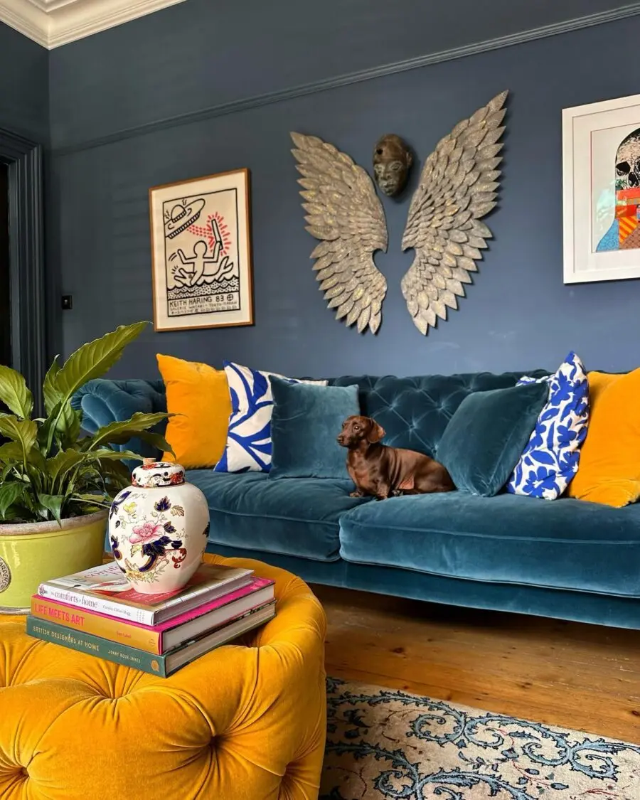 Chic blue velvet sofa with vibrant accents