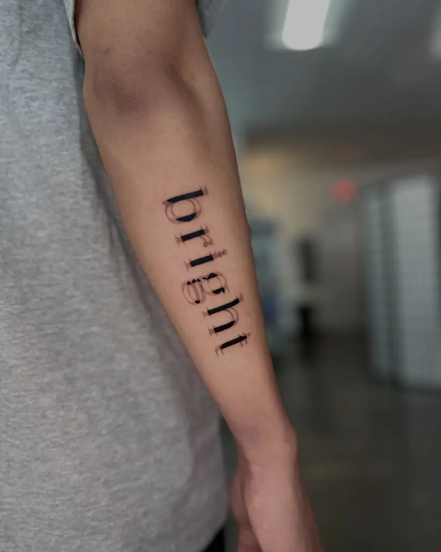 Inspiring one-word tattoo showcasing 'bright'