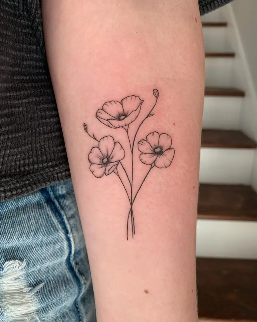 Elegant buttercup floral tattoo design on arm