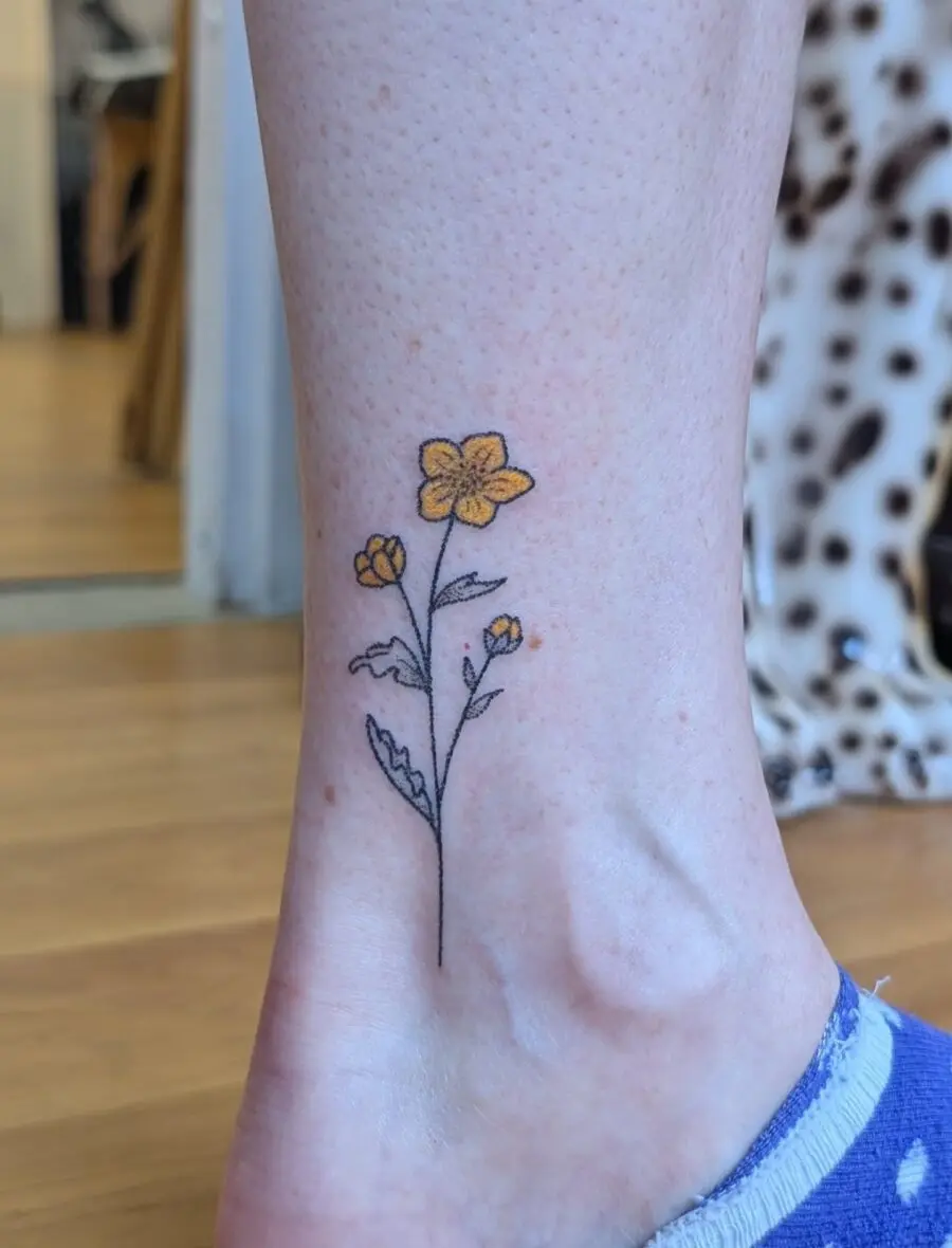 Charming Buttercup Floral Ankle Tattoo Inspiration