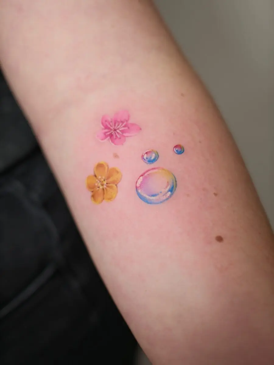 Vibrant buttercup and bubbles tattoo design