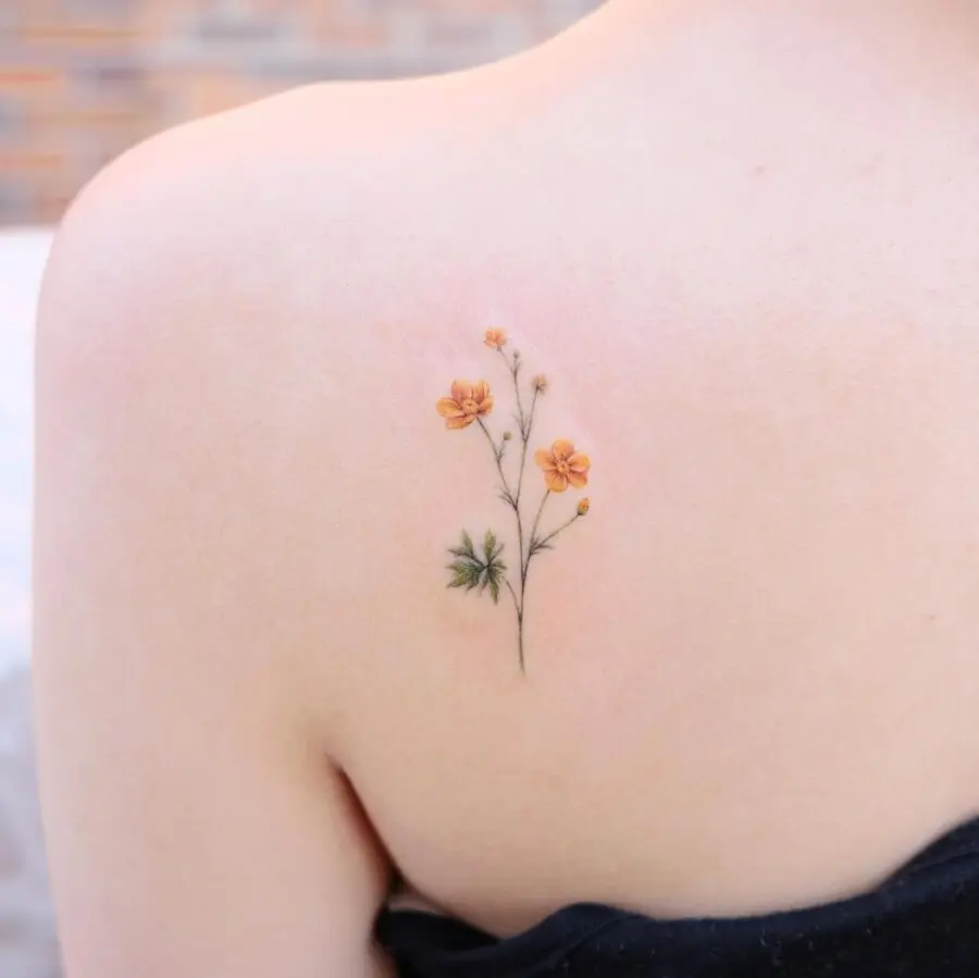 Whimsical buttercup flower tattoo with soft tones