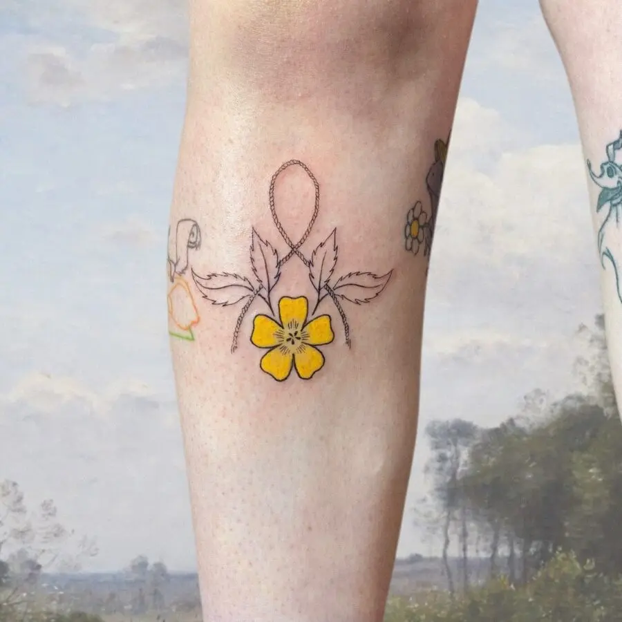 Charming buttercup tattoo on the leg