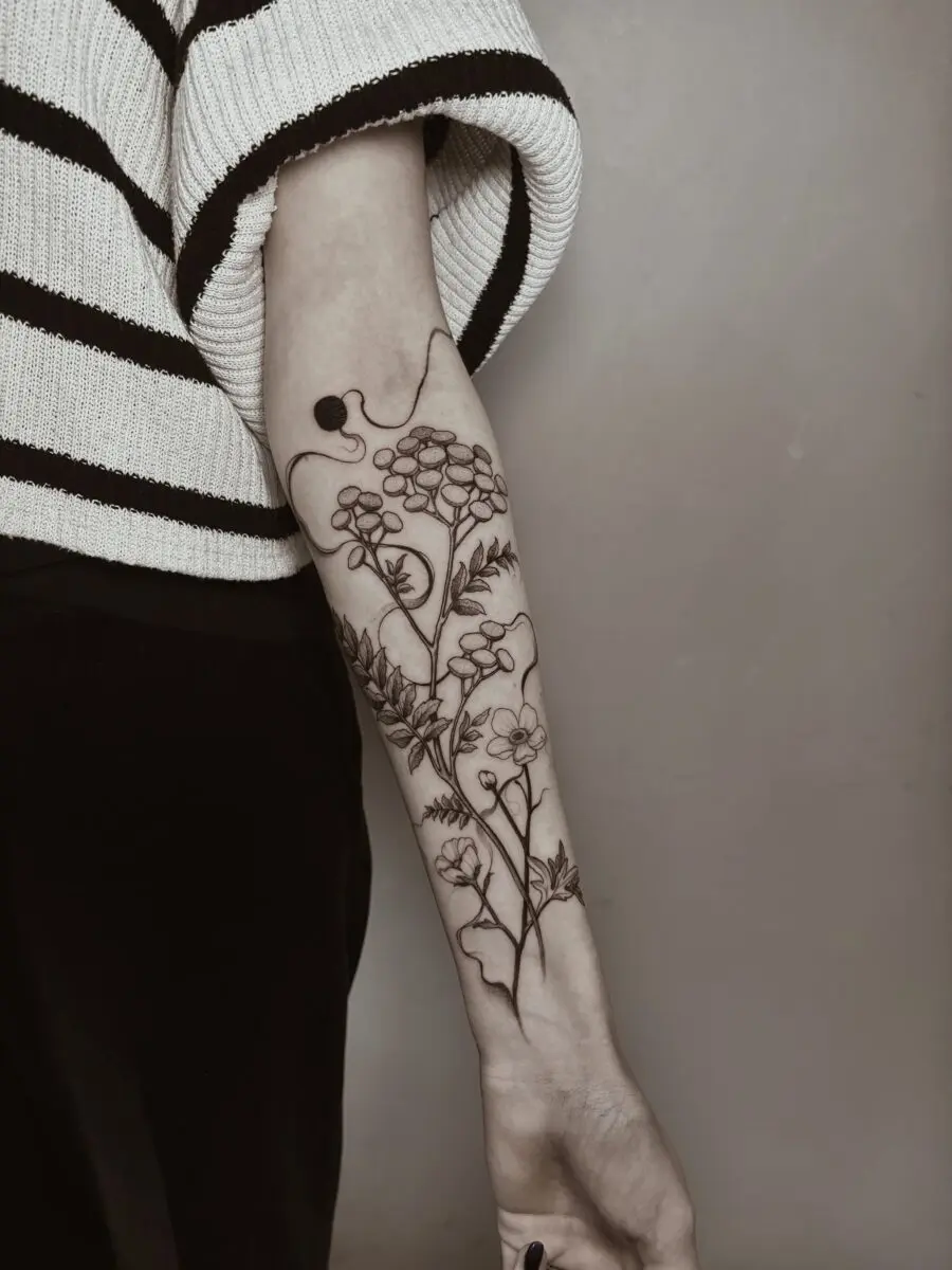 Elegant buttercup tattoo showcasing natural beauty