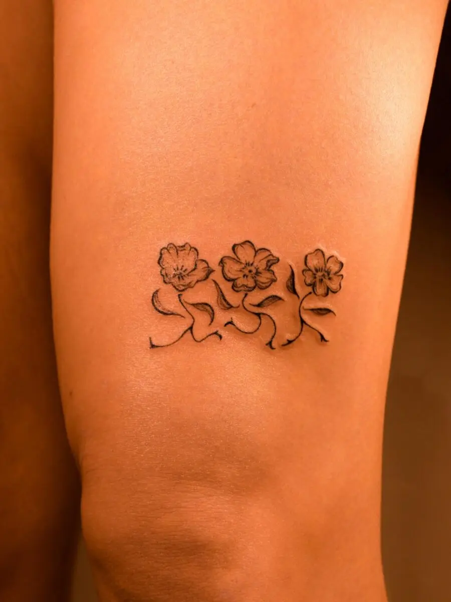 Elegant Buttercup Tattoo on Smooth Skin