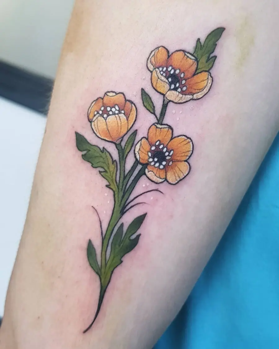 Delicate buttercup floral tattoo design on arm