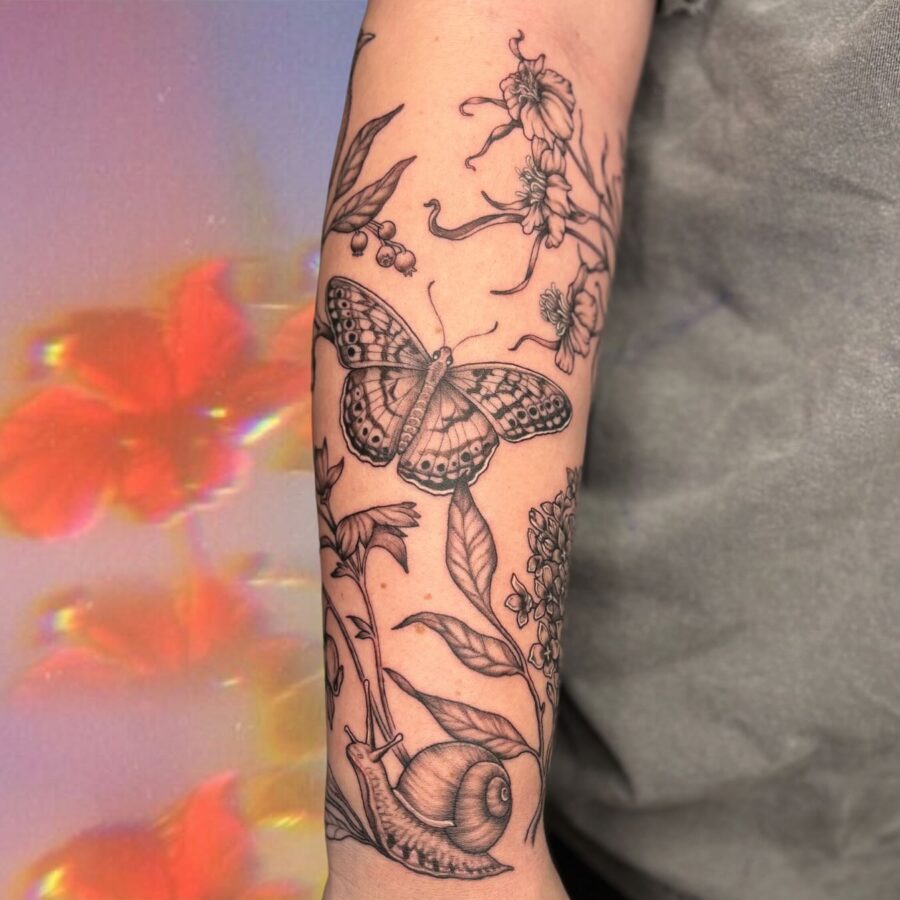 Elegant floral half sleeve tattoo design
