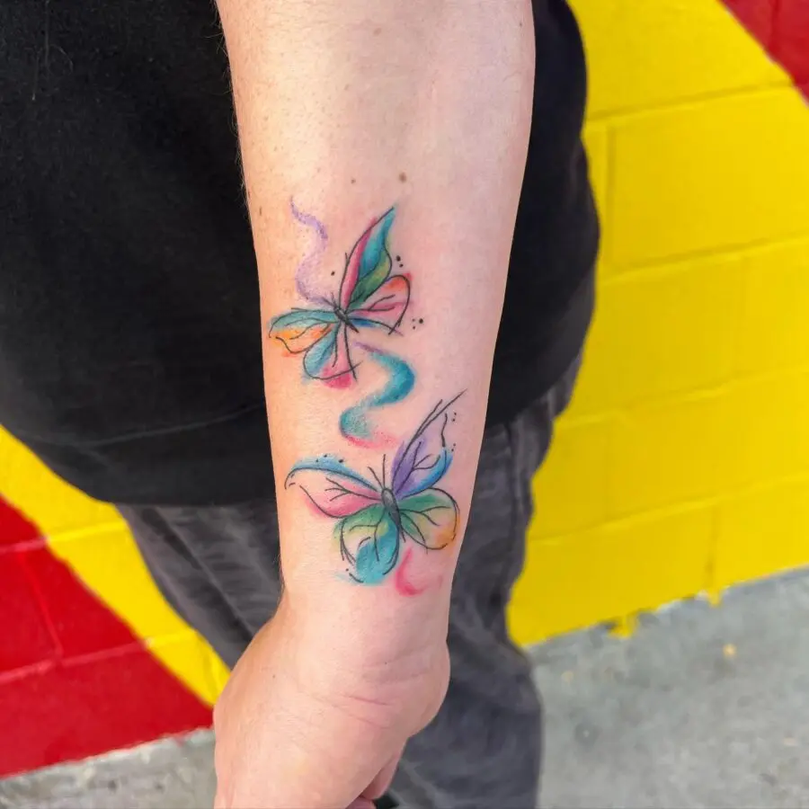 Colorful butterfly tattoos symbolizing new beginnings.