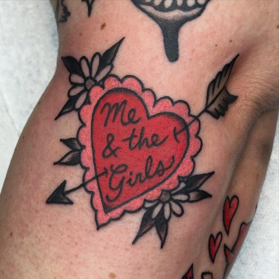 Playful heart tattoo celebrating friendship.