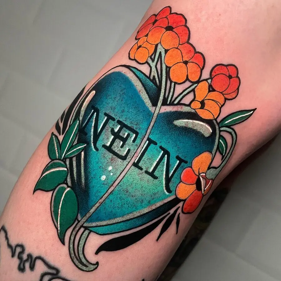 Vibrant heart tattoo with a bold message